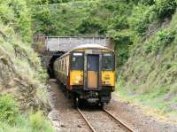 A slightly tatty looking 318269, forming a Largs - Glasgow Central service, leaves the south portal of Fairlie tunnel and slows for the station stop on 17 May 2007.<br><br>[John Furnevel 17/05/2007]