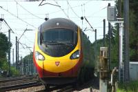 A London bound Pendolino hurries along the Up Fast at Euxton on the afternoon of 27 June 2015.<br><br>[John McIntyre 27/06/2015]