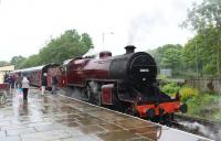 LMS Hughes Crab 13065 standing in the rain at Rawenstall on 20 June 2015.<br><br>[Peter Todd 20/06/2015]