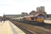 66148 pauses to change crew at Leicester, as it hauls empty cement wagons back to Ketton works.<br><br>[Ken Strachan 19/06/2015]