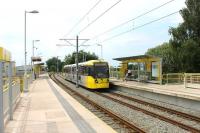 The first station at Hollinwood was opened by the L&YR in 1880. It closed in 2009 when rail services on the Oldham Loop ceased and was completely rebuilt for Metrolink services. 3044 calls on its way to Rochdale. [See image 42860] for the same location in 2009.  <br><br>[Mark Bartlett 01/7/2015]