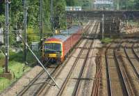 A Shieldmuir to Warrington mail train approaching Balshaw Lane Junction on the Up Fast line on 18 June 2015. On the Slow lines on the right is Euxton Balshaw Lane station.<br><br>[John McIntyre 18/06/2015]