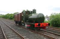 The Barclay fireless ex-Shell Ardrossan locomotive in steam at ARPG Dunaskin on 5 July 2015 trundling about with a gunpowder wagon. (Steam is obtained by firing up conventional Barclay 0-4-0T no 10 then transferring steam via a pipe to the receiver on the fireless loco.) [See image 37623]<br><br>[Colin Miller 05/07/2015]