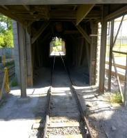 Ordinarily, this sort of view from the end of a passenger train would be rather worrying. But passing under the cement loading hoppers at Ketton Cement Works is all in a day's recreation for BLS members [see image 51693].<br><br>[Ken Strachan 07/06/2015]