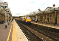 <h4><a href='/locations/L/Loughborough_Midland'>Loughborough Midland</a></h4><p><small><a href='/companies/M/Midland_Counties_Railway'>Midland Counties Railway</a></small></p><p>The picture postcard railway: a down Meridian passes through Loughborough on 19th June. 27/29</p><p>19/06/2015<br><small><a href='/contributors/Ken_Strachan'>Ken Strachan</a></small></p>