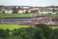 Another view of the Bargeddie bridge works taken from Tannochside Industrial estate on 10th July 2015. Note the original <I>Cutty Sark</I> bridge partially obscured by the new structure centre right [see image 14734]. <br><br>[Colin McDonald 10/07/2015]