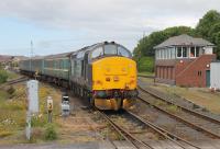 Having worked a Carlisle - Barrow - Preston - Barrow diagram on 22 June, 37402 is pulled into the carriage sidings at Barrow by 37218 for a three hour layover. After this they will work a return trip to Carlisle before being stabled here overnight.<br><br>[Mark Bartlett 22/06/2015]