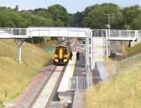 A deceptively rural scene at the new Eskbank station on 10 July 2015 with the crew of the 0959 Tweedbank - Newcraighall awaiting departure time for the next leg to Shawfair.<br><br>[John Furnevel 10/07/2015]