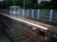 The western extension to the Edinburgh-bound platform at Croy, seen from a passing train on a wet 13 July 2015. <br>
<br><br>[John Yellowlees 13/07/2015]