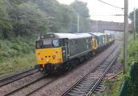 <I>A Classic Traction Quintet</I>. DCR 31601 <I>Devon Diesel Society</I> leads four BKR diesels through the rain at Hest Bank on 13th July, returning to Bo'ness after the ELR diesel gala. Dead in train are 37025, 20020, 47643 and 26038.<br><br>[Mark Bartlett 13/07/2015]