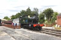 Ex-GWR Collett 2-6-2T 5542 about to go on shed at Toddington on 11 July 2015. In the background Freightliner 47376 stands at the platform with a train.<br><br>[Peter Todd 11/07/2015]