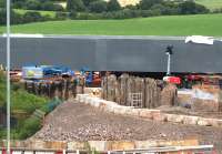 The east (Cutty Sark) end of the new structure on 12th July 2015. The OHLE, track work and ballast have been removed and the piling previously inserted though the trackbed is now exposed.<br><br>[Colin McDonald 12/07/2015]