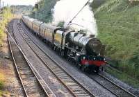 46115 <I>Scots Guardsman</I> wheels the empty stock of <I>The Fellsman</I> through a sunny Hest Bank on the 15th July 2015. The train is on the short run from Carnforth to its first pick up point in Lancaster. <br><br>[Mark Bartlett 15/07/2015]