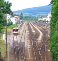 The 09.06 departure from Furth im Wald to Domazlice and Pilsen on 27th June is dwarfed by the surrounding unused infrastructure, the latter being partly due to engineering works which were blocking through long-distance passenger and freight trains on this route from Bavaria to Bohemia.<br><br>[David Spaven 27/06/2015]