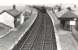 Hurlford shed's Standard Mogul 77016 passing through Drybridge station on 3 August 1958 with a Sunday Ayr to Kilmarnock train. [Ref query 13886]   <br><br>[G H Robin collection by courtesy of the Mitchell Library, Glasgow 03/08/1958]