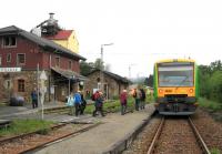 Scene at Spiegelau on the Zwiesel-Grafenau branch, one of the stations where overnight visitors benefit from free regional public transport using the Bayerischer Wald 'Nationalpark-Card'. Here ramblers join a morning train to Zwiesel on 20th June. The station platform has yet to be upgraded (and redundant loop and siding lines remain in situ) but the station building is being converted into a caf / restaurant.<br><br>[David Spaven 20/06/2015]