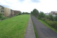 The cycle path is now well established on the trackbed of the line from Partick Central to Yoker, seen here on 18 July 2015 passing the remains of the island platform at Scotstoun East. [See Image 8607] for a similar view in 1988.<br><br>[Malcolm Chattwood 18/07/2015]