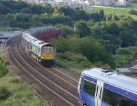 Freightliner 66619 coming off Jamestown Viaduct with an Aberdeen - Oxwellmains cement train about to pass 170433 on a northbound service.<br><br>[Bill Roberton 15/07/2015]