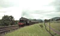 Black 5 45011 south of Abington on 10 July 1965 with an up ballast train. <br><br>[John Robin 10/07/1965]