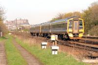 A westbound departure from Edinburgh approaching Balgreen, photographed shortly after leaving Haymarket station in 1999. The rough track on the left of the picture now carries Edinburgh's Trams.  <br><br>[Ewan Crawford //1999]