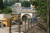 The south end of Farnworth Tunnel on 17 July 2015, with the outline of the new double-track portal now formed in advance of the tunnel boring machine starting its work. The footpath leading to this spot will close from 21 July until the work has been completed. Meantime the smaller down tunnel off to the left continues to be used for bi-directional working. [See image 51621]<br><br>[John McIntyre 17/07/2015]