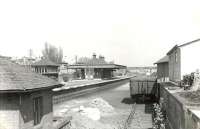 Looking north through Muirend station in April 1960. A location much 'rationalised' over the years, although the main station building thankfully survives. [See image 14923]<br><br>[G H Robin collection by courtesy of the Mitchell Library, Glasgow 29/04/1960]