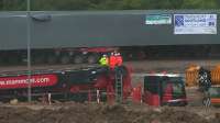 The new section of Bargeddie Bridge being carefully manoeuvred into position on the Mammoet transporters during a downpour on 17th July 2015.<br><br>[Colin McDonald 17/07/2015]