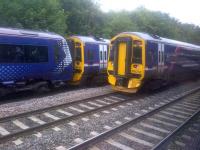 In the final week of Winchburgh diversions, 158733 on a local from Fife waits to follow a reversing Dunblane-Edinburgh train at Dalmeny Junction on 21 July 2015. View from the 0850 Edinburgh-Dunblane which is itself in the process of reversing.<br><br>[John Yellowlees 21/07/2015]