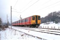 SPT liveried 314209 approaching Hillfoot station from Milngavie on a winter's day in 1991 with a service to Springburn.<br>
<br><br>[Ewan Crawford //1991]