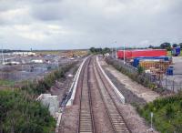 The embryonic Edinburgh Gateway station - due to open next year - seen here in July 2015. The platform edging supports are up. On the left are signs of the fancy work needed to connect the rail station with the new tram stop, not quite adjacent and lower down.<br>
<br><br>[David Panton 23/07/2015]