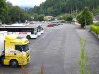 Looking west from the Ancaster Road over the site of Callander (Dreadnought) Station on 20 July 2015, with tour buses standing where trains once called. [See image 22795]<br><br>[Bill Roberton 20/07/2015]