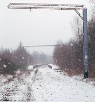 Looking south towards the site of Balloch Central along the former Balloch Pier branch on a winter's day in 1991. The station had closed 3 years earlier when a replacement opened on the other side of Balloch Road, enabling removal of the busy level crossing.<br><br>[Ewan Crawford //1991]