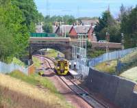 The crew of train 2Z12, the 0851 Newcraighall - Tweedbank, takes to the platform during the scheduled stop at Newtongrange during a break in the clouds on 24 July 2015. Through the haze in the background a tanker can just be made out heading for the oil terminal at Hound Point in the Firth of Forth. <br><br>[John Furnevel 24/07/2015]