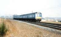 A Derby dmu heading for Largs, photographed at Dalgarven, north of Kilwinning, in June 1969.<br><br>[Colin Miller /06/1969]