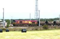 EWS 66205 pauses to change crews on the west side of Kingmoor yard in May 2003 with a northbound train of coal empties destined for Ayrshire.<br><br>[John Furnevel 25/05/2003]