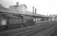 Class O2 2-8-0 63933 takes an up freight through Doncaster in July 1961.<br><br>[K A Gray 29/07/1961]