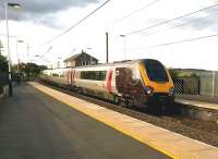 An up Voyager speeds through Alnmouth on 12th July 2015. Notice the signal box, and the viaduct over the River Aln just visible on the far right - '18 Arches' - which can be seen from the footbridge at the Aln Valley Railway's Lionheart station.<br><br>[Ken Strachan 12/07/2015]