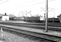 A combined Glasgow/Edinburgh - Birmingham train about to depart from Carstairs in September 1981 behind a class 86 electric locomotive.<br><br>[John Furnevel 13/09/1981]