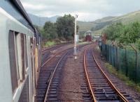 37409 approaching Glen Douglas loop from the south in 1988. The signalposts were still in place and signalbox still stood despite its closure in January 1986. Sprinters were to be introduced shortly and the vast majority of passengers were there to enjoy the 37s. The track to the right provides access to the NATO depot.<br><br>[Ewan Crawford 03/09/1988]