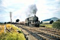 View north at Symington on Saturday 29 August 1959. The locomotive with the southbound freight just about to run through the station heading for Carlisle is Kingmoor Black 5 no 45009.  <br><br>[A Snapper (Courtesy Bruce McCartney) 29/08/1959]