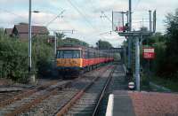 303028 enters Milngavie station passing the semaphore signals in 1988.<br><br>[Ewan Crawford //1988]