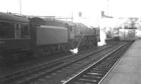 Looking through Victoria Viaduct towards Carlisle No 4 box on 22 February 1964 as the 11am service to Glasgow St Enoch prepares to leave platform 3 behind Britannia Pacific 70013 <I>Oliver Cromwell</I>. <br><br>[K A Gray 22/02/1964]
