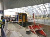 Passengers boarding a 158 at Manchester Victoria on 18 July heading for Huddersfield. Love that new roof. [See image 49339]<br><br>[Ken Strachan 18/07/2015]