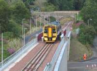 ScotRail 158725 about to cross Wheatlands Road bridge on the northern approach to Galashiels station on 12 August 2015 with a mid-morning Newcraighall - Tweedbank crew training working.<br><br>[John Furnevel 12/08/2015]