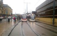 Edinburgh trams passing at Haymarket on a damp 14 August.<br><br>[John Yellowlees 14/08/2015]