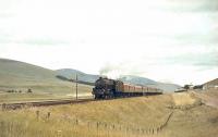 A southbound train photographed near Wandel Mill on 19 July 1965, hauled by Black 5 44887.<br><br>[John Robin 19/07/1965]