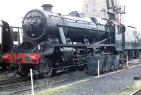 Ex-LMS Stanier 8F 2-8-0 No 48151, built at Crewe in September 1942 and eventually withdrawn from Northwich shed in January 1968. Rescued from Barry scrapyard in 1975 the locomotive now operates regular charters on behalf of West Coast Railways. Photographed at Carnforth in the early 1990s. [See image 47682] <br><br>[John Steven //]