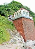 The lower station of the Babbacombe Cliff Railway sits on a sturdy stone buttress and there is a ramp for passengers to access Oddicombe Beach [see image 19532]. Viewed from below the substantial railcars seem tiny. The <I>Friends of Babbacombe Cliff Railway</I> have established an informative visitor centre on the beach which is well worth a visit.  <br><br>[Mark Bartlett 28/07/2015]