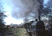 Passengers on <I>Scottish Rambler No 2</I> transported in trucks down to Garlieston behind Caley Jumbo 57375 on 15 April 1963. The train is seen here shortly after arrival and is about to run forward along the harbour branch, following which 57375 will propel the train back to Millisle Junction.<br><br>[John Robin 15/04/1963]