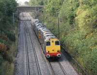 Super power on the flasks. The Crewe - Sellafield train is coasting slowly down the bank towards Lancaster station, with two wagons in tow, on 19th August 2015. Motive power for the train, all with engines running, comprised DRS 20308, 20305, 37612 and 37610.<br><br>[Mark Bartlett 19/08/2015]